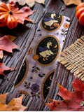 Feuille d'autocollants Halloween avec des canards sorciers sur fond vichy mauve